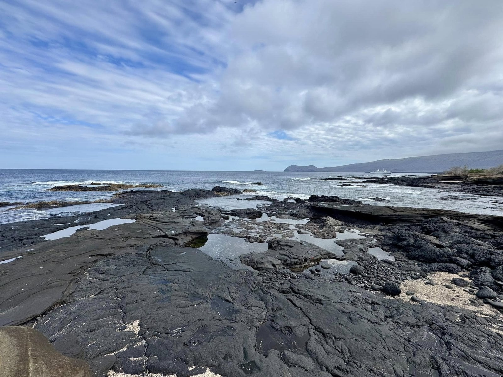 Expansive intertidal black basalt lava flats at Puerto Egas on Santiago Island