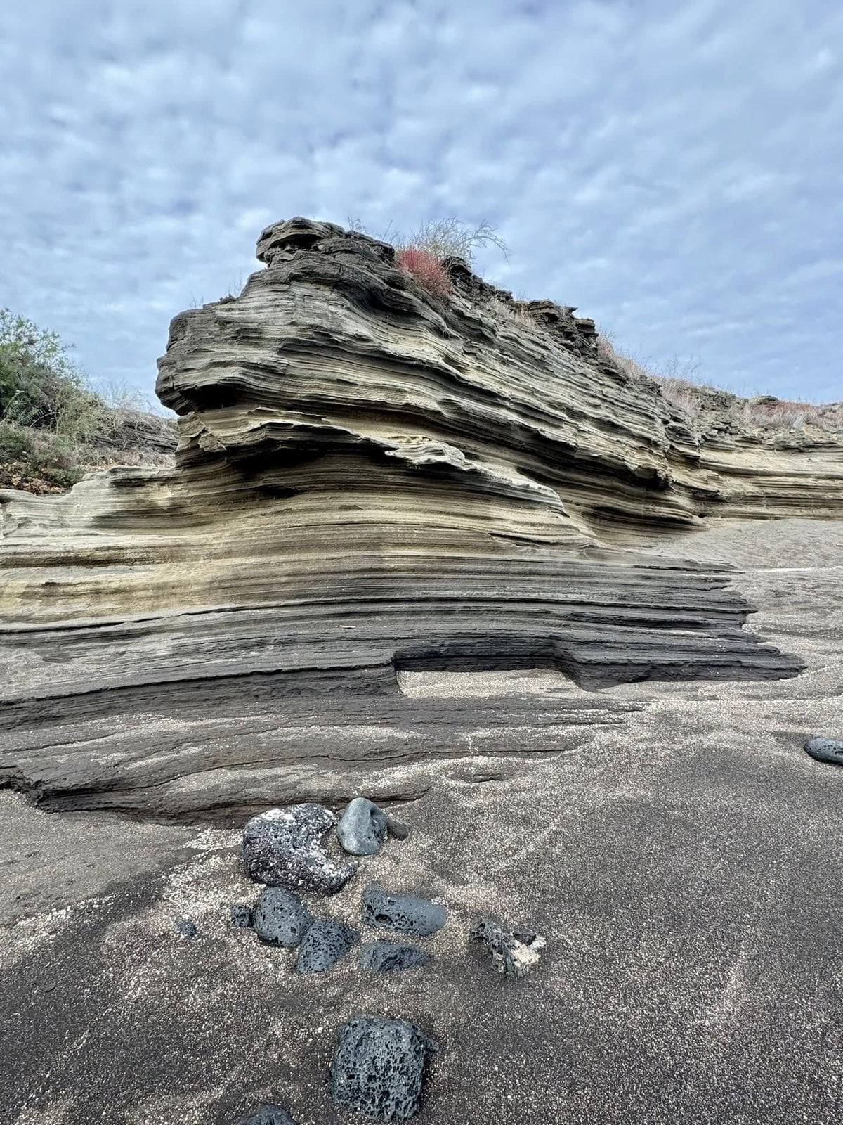 Fascinating geological layers of compressed volcanic ash and tuff sculpted by ocean waves