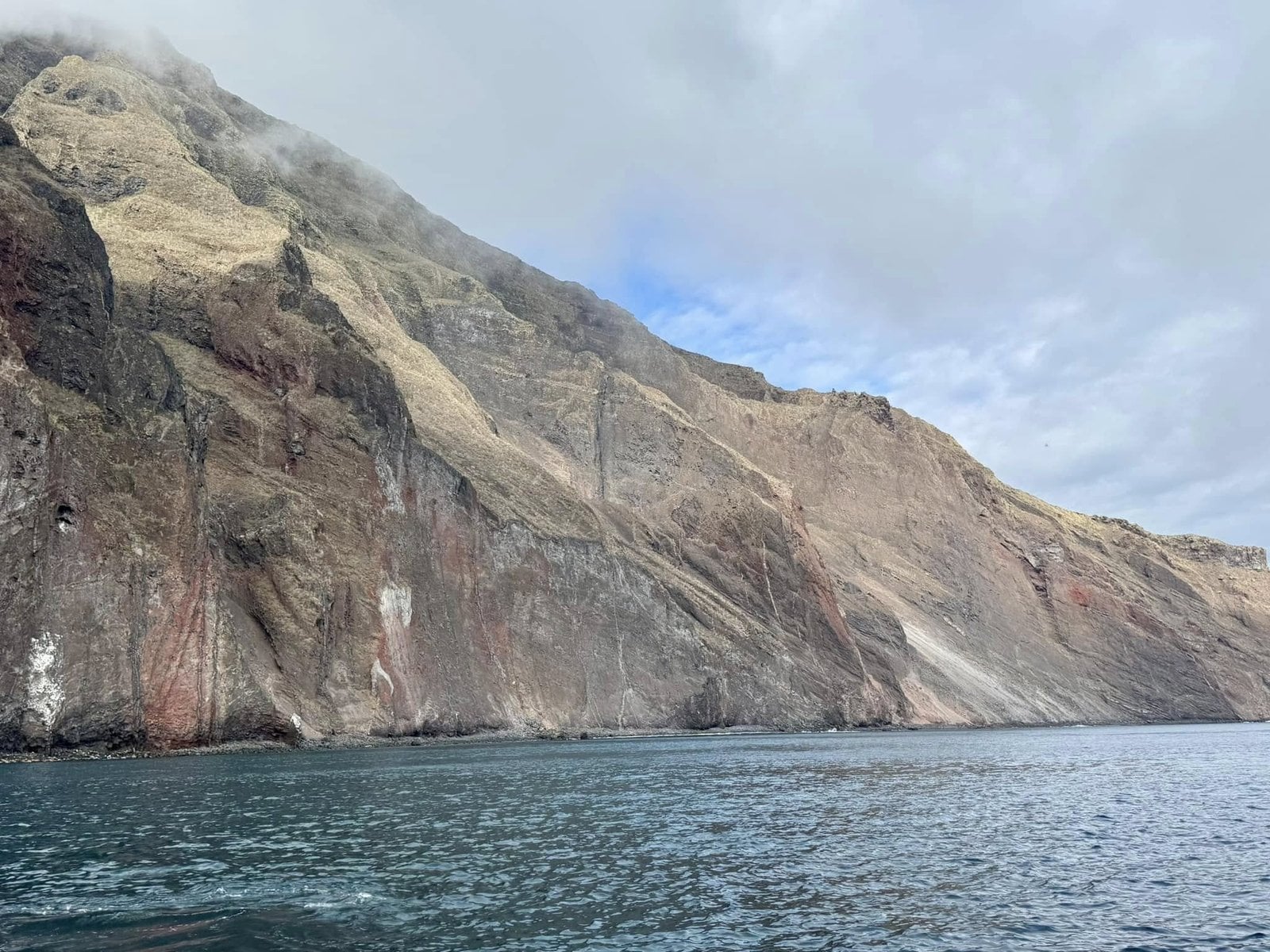 Dramatic sheer volcanic cliffs of Ecuador Volcano at Punta Vicente Roca on Isabela Island
