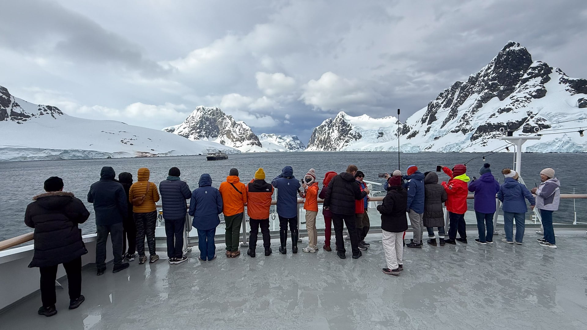 MS Fridtjof Nansen navigating the towering granite cliffs of the Lemaire Channel in Antarctica
