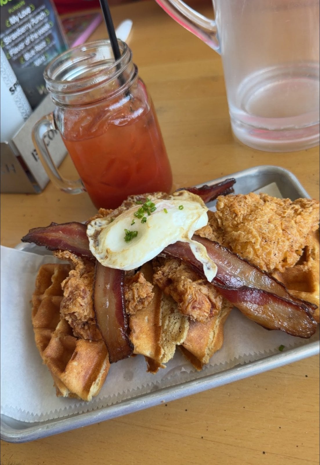 Chicken and waffles with bacon during pre-cruise brunch in Miami before boarding Virgin Voyages Scarlet Lady