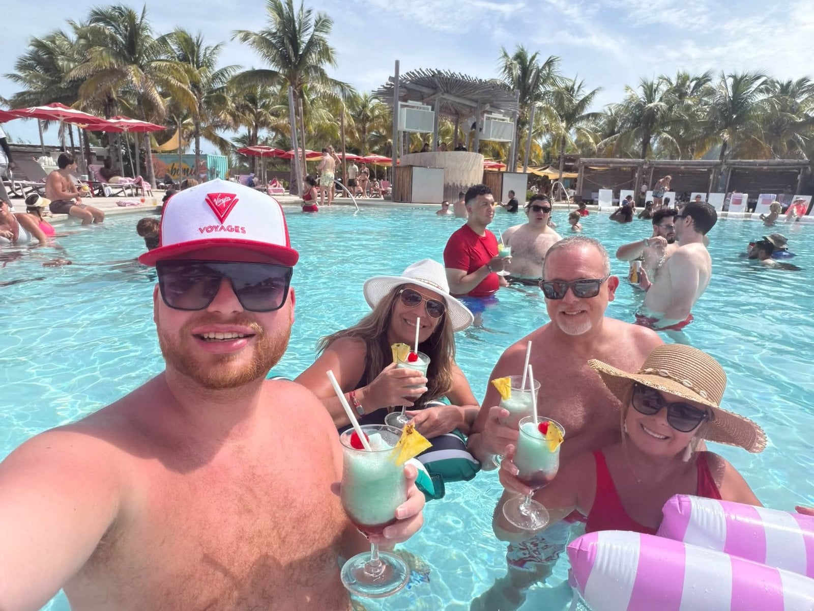 Logan White and family in the lagoon pool at The Beach Club at Bimini during his Virgin Voyages Scarlet Lady cruise