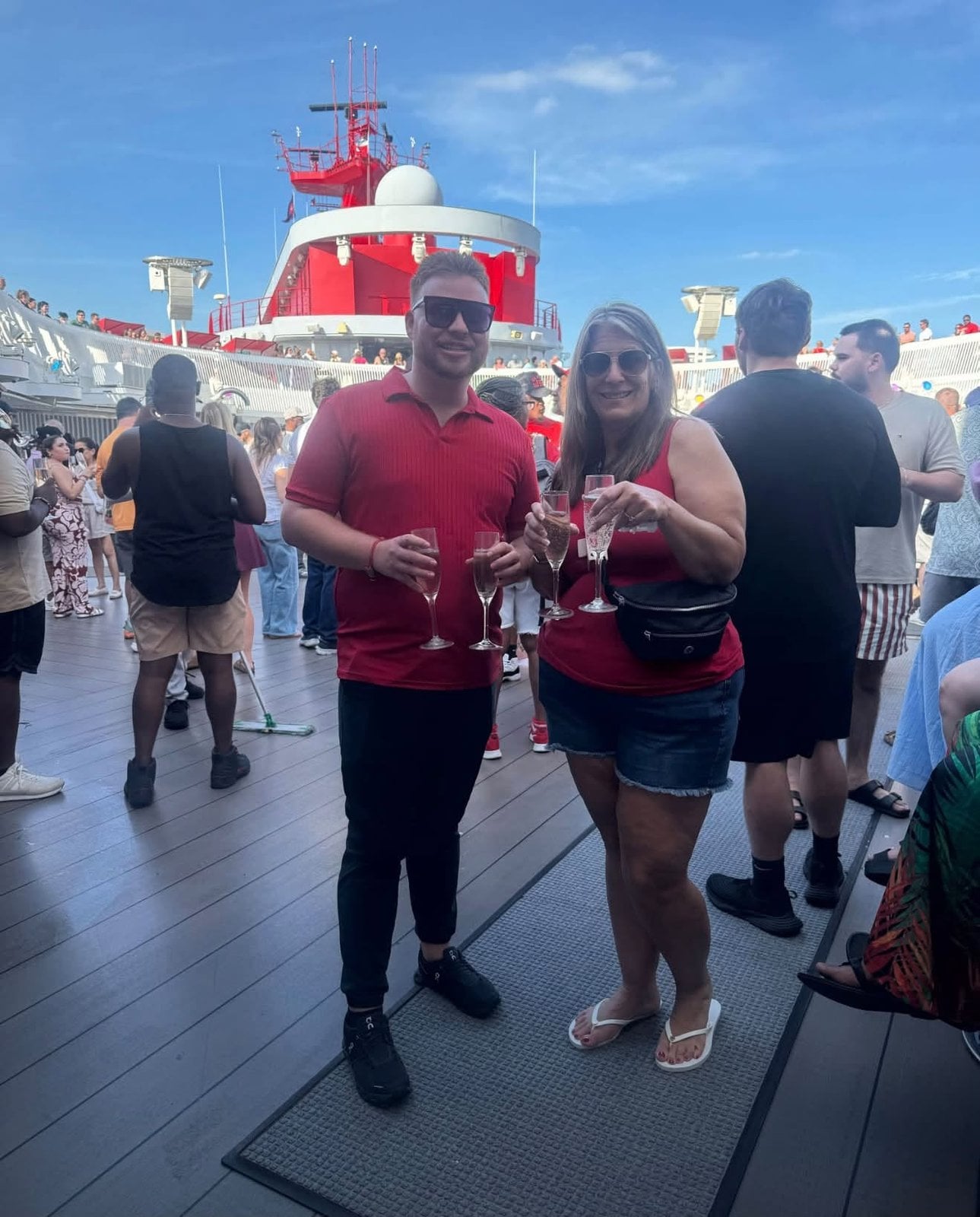 Soaking in the adults-only energy on deck during the Scarlet Lady sail-away party