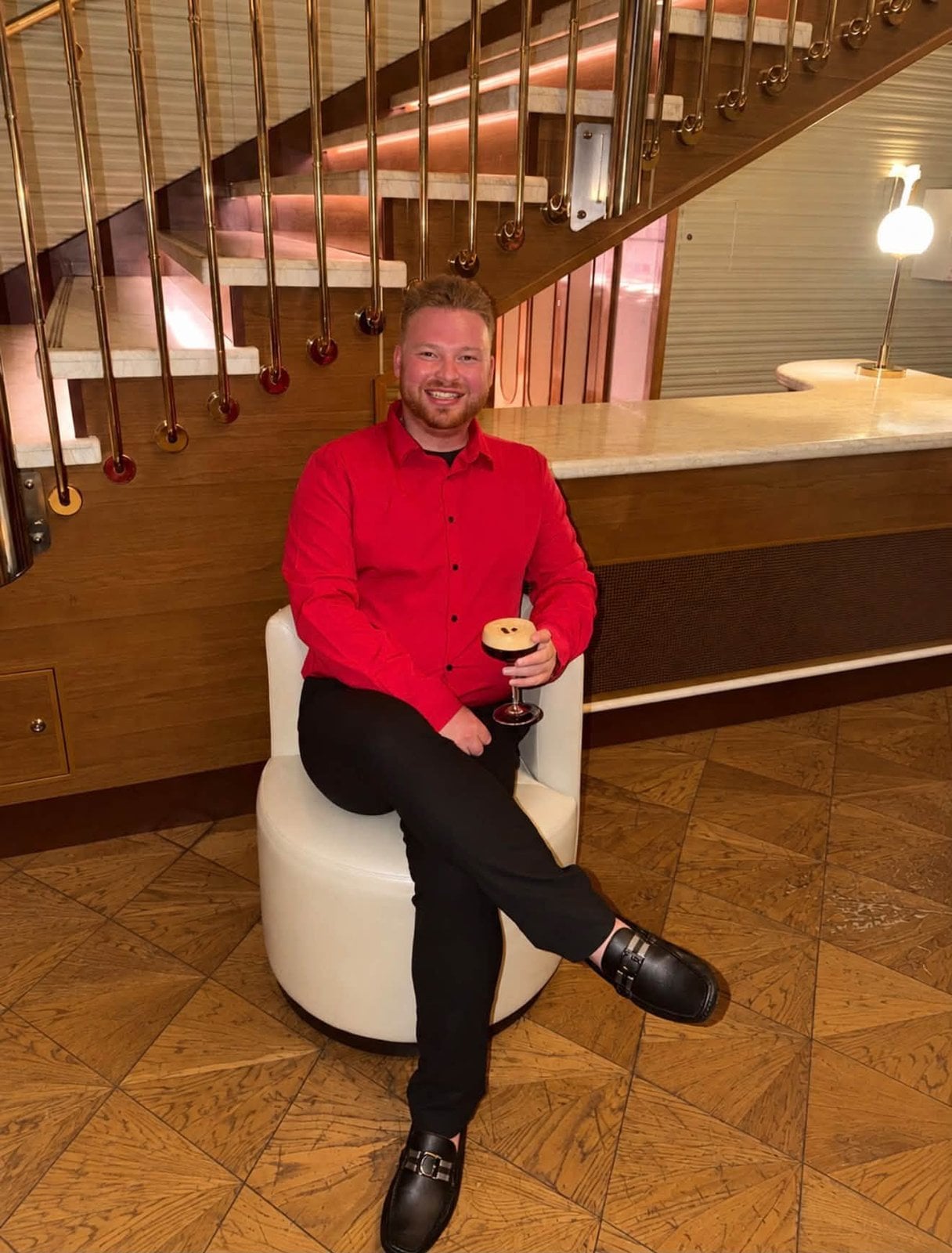 Logan White enjoying an espresso martini on Scarlet Night aboard Virgin Voyages