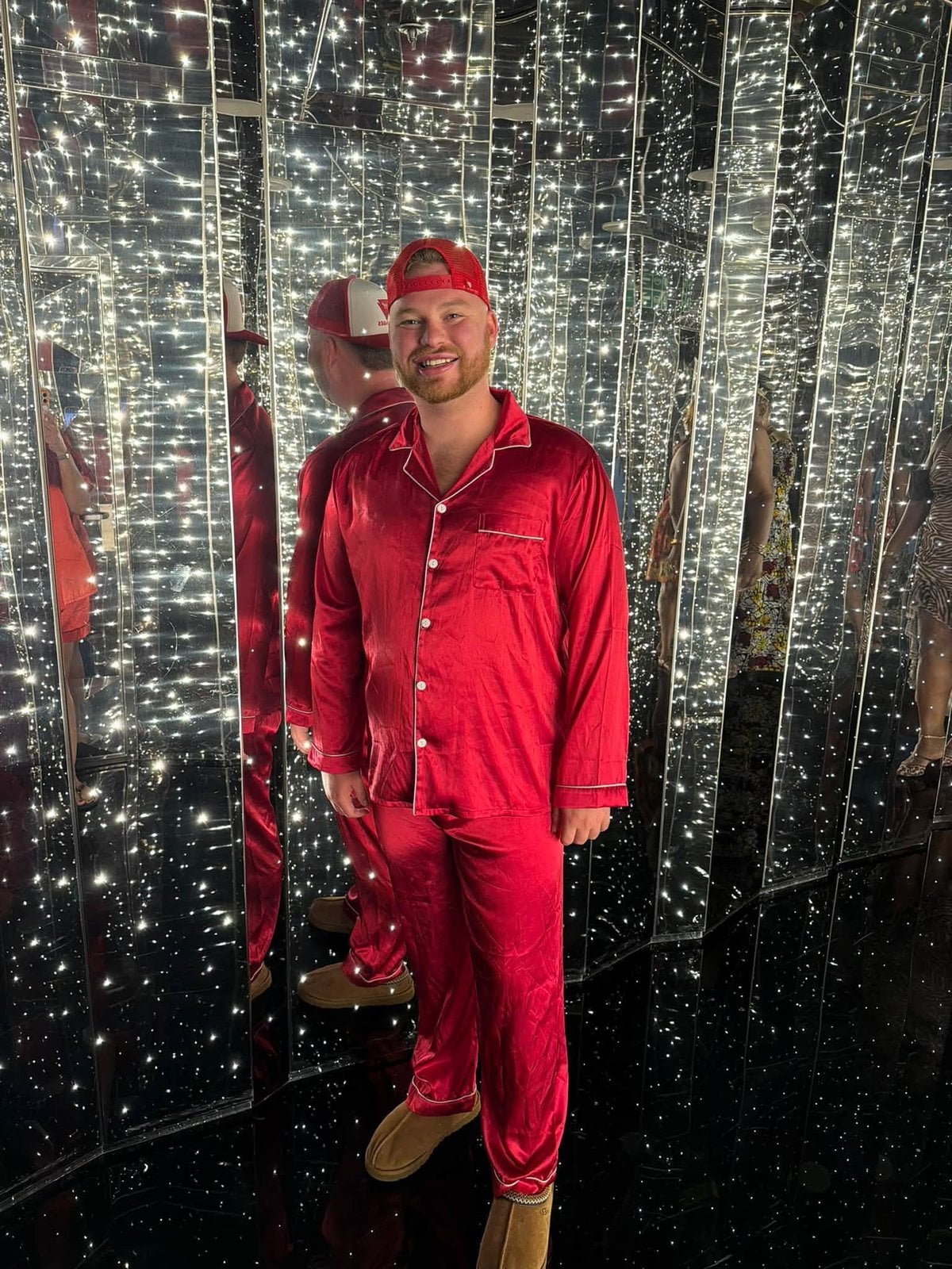 Ready to dance the night away in red silk PJs at Virgin Voyages' legendary PJ Party