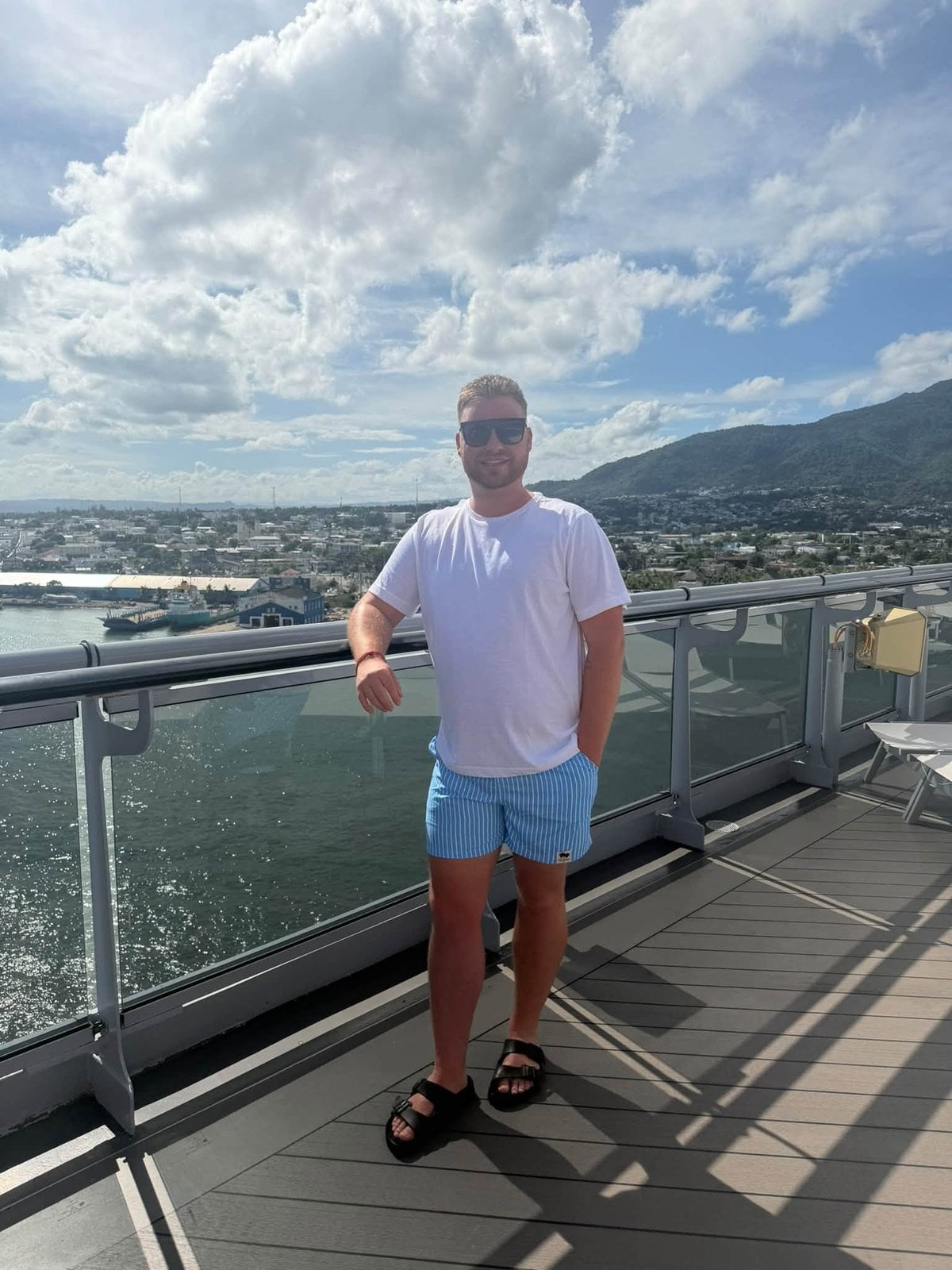 Taking in panoramic coastal mountain and harbor views from the top deck