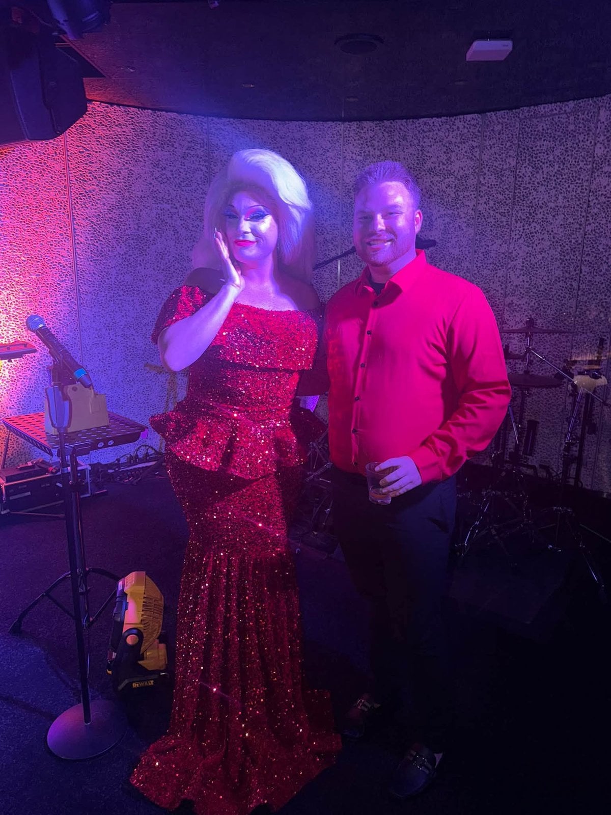 Logan White onstage with The Diva, Virgin Voyages' resident drag performer on Scarlet Lady