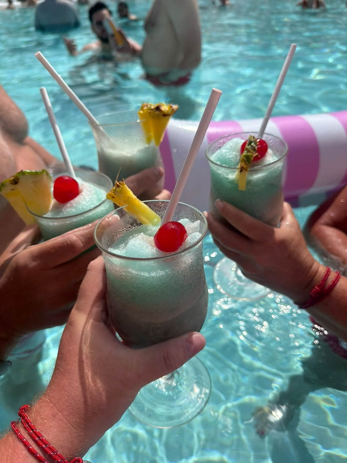Toasting with frozen pineapple cocktails in the lagoon pool at Bimini Beach Club