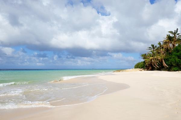 Secluded Turtle Cove white sand beach at Malliouhana
