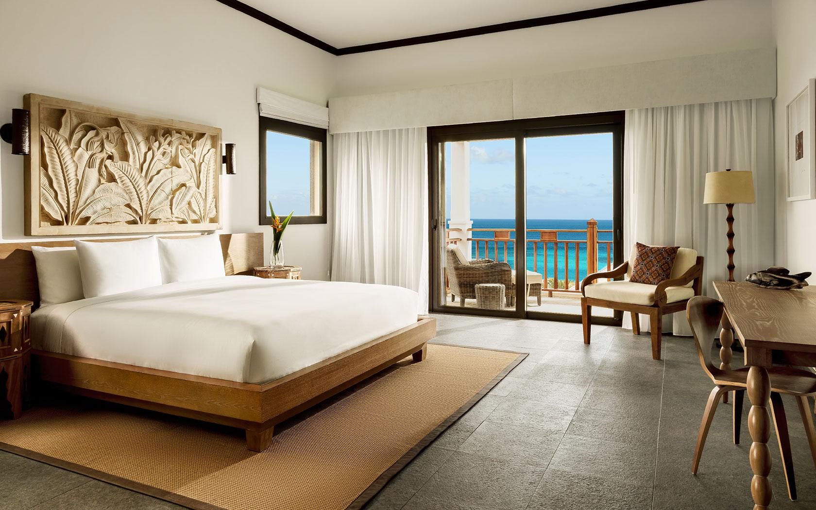 Deluxe Ocean View Room with handcrafted wood at Zemi Beach House