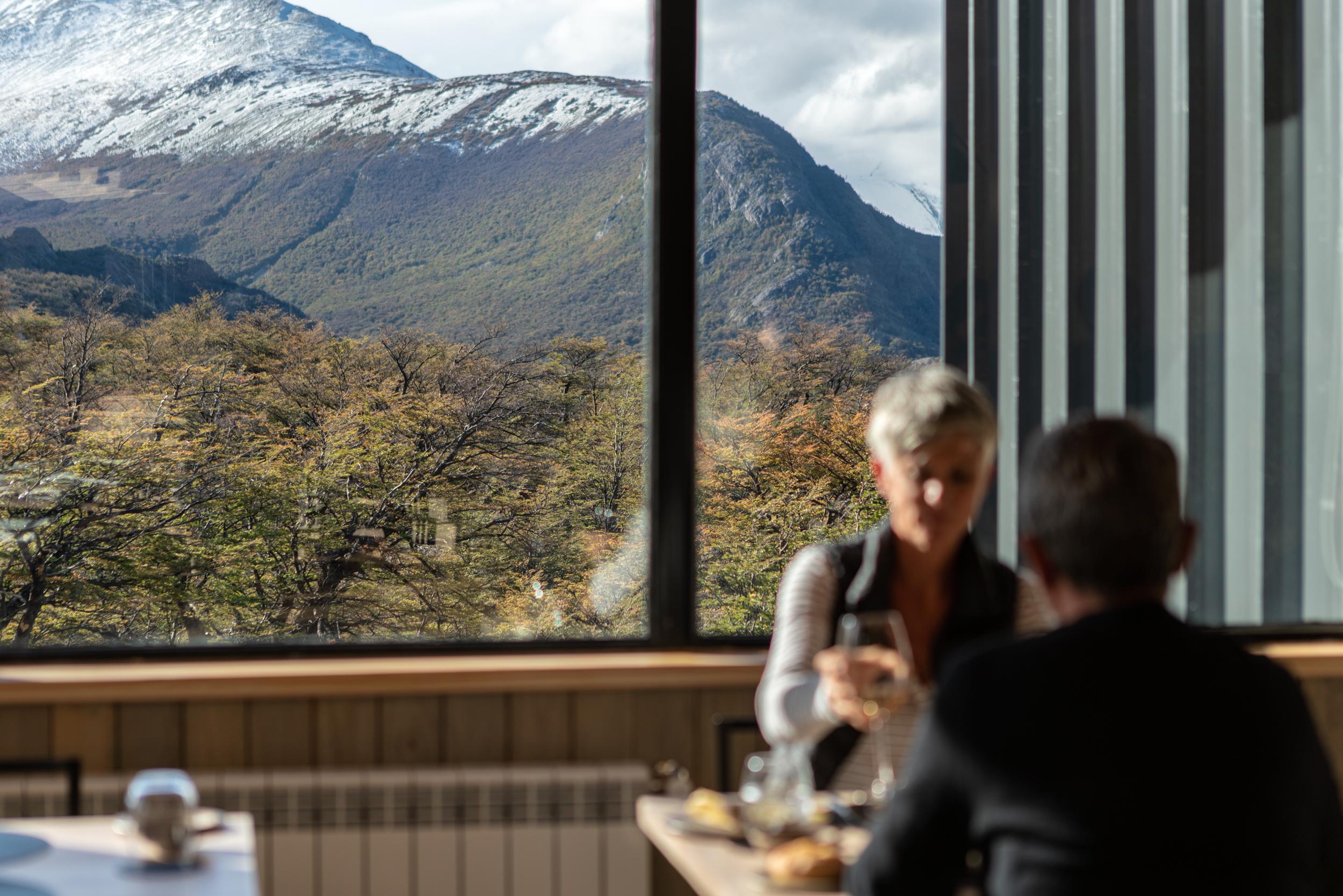 Explora dining room with floor-to-ceiling wilderness panoramas