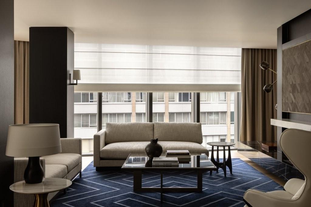 Capella Suite expansive master living salon with curated Australian artwork and city skyline vistas