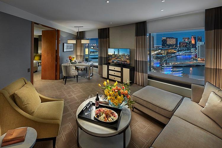 Executive Club Suite separate living room with plush furnishings and Crystal Club privileges
