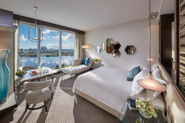 Premier King Room featuring handcrafted finishes, plush king bed, and river views
