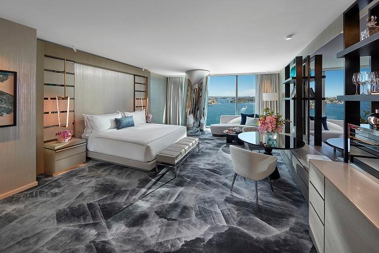 Deluxe King Room featuring coastal neutral upholstery and dark marble bathroom