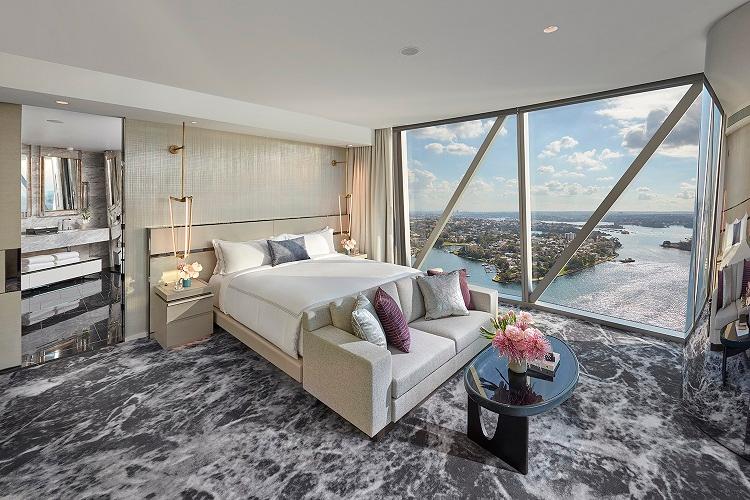 Premier Suite open-plan corner layout with floor-to-ceiling windows and designer furnishings