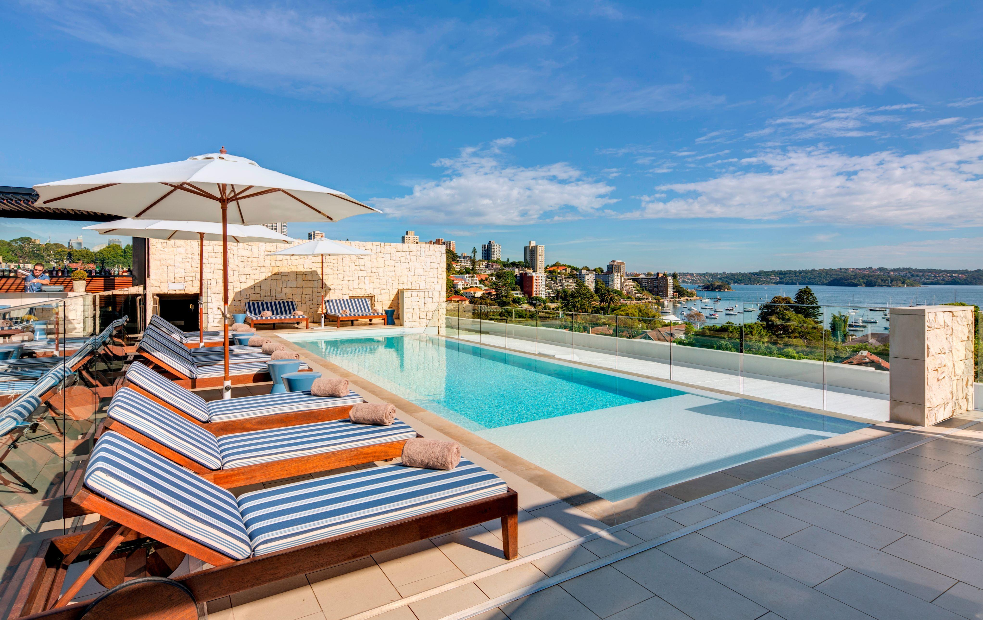 Rooftop swimming pool and lounge overlooking Double Bay and Sydney Harbour