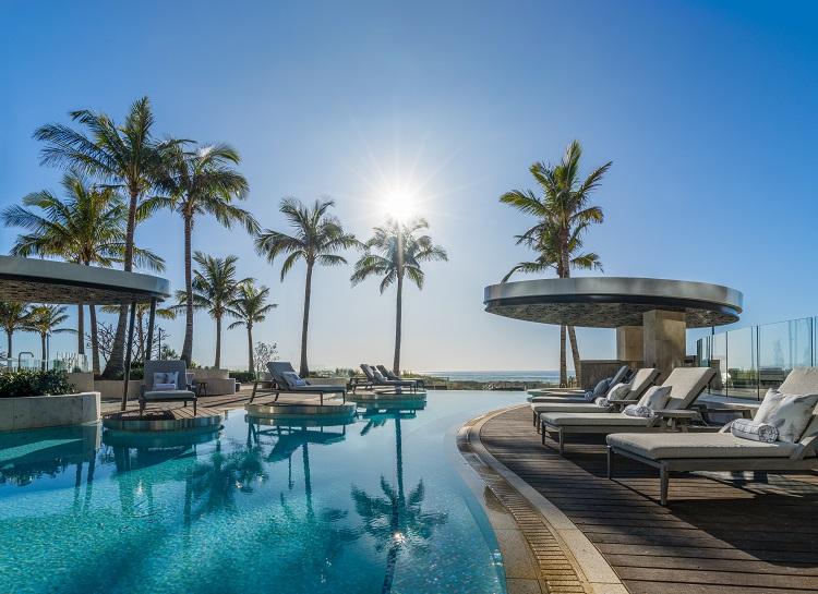 Outdoor lagoon pool with direct views across the beach
