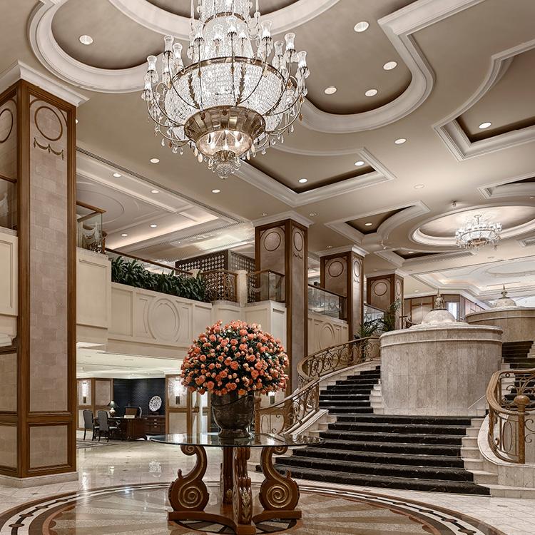Grand marble foyer with cascading fountain and staircases