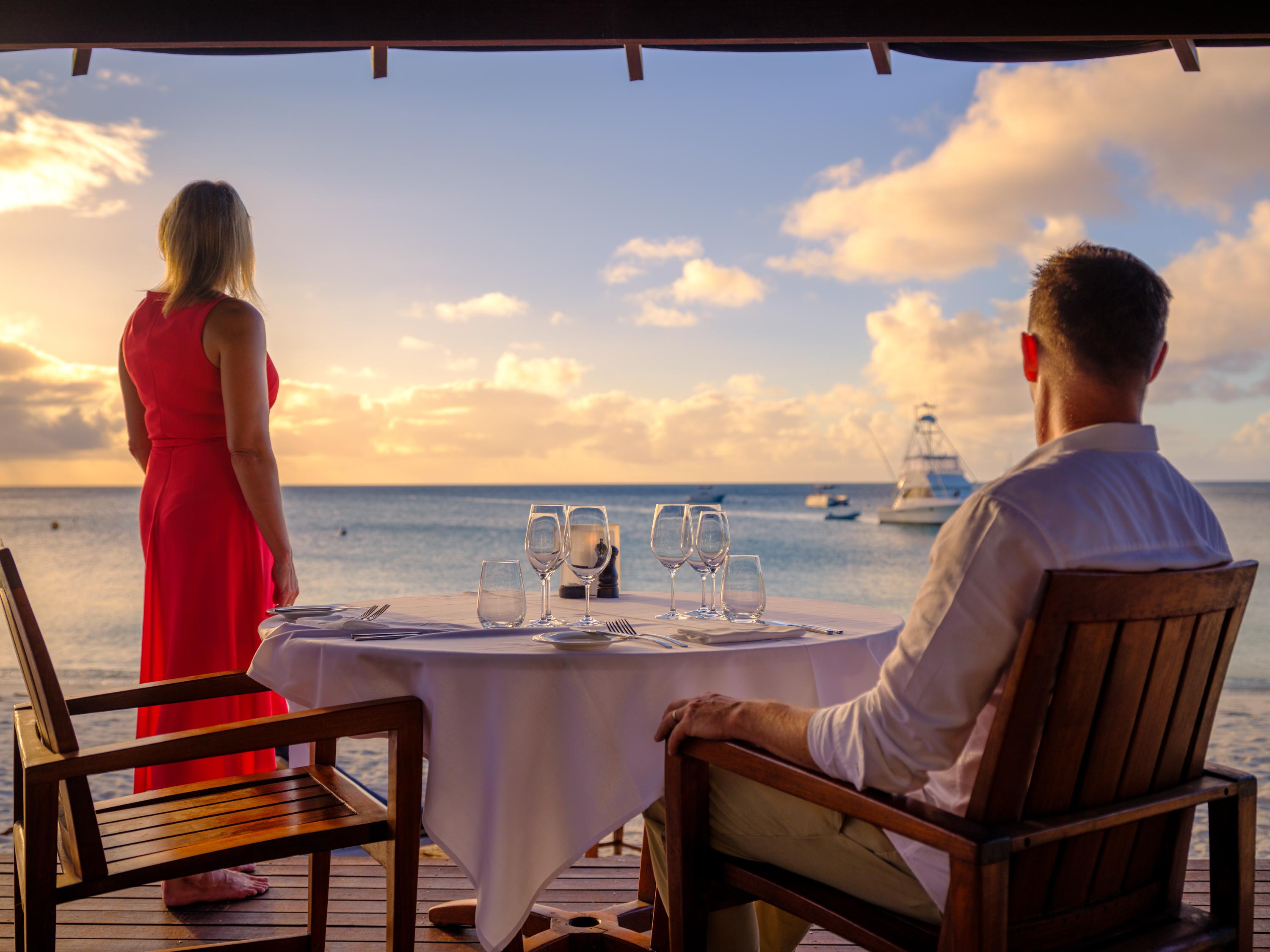 Private degustation beachfront dining pavilion overlooking Anchor Bay at sunset