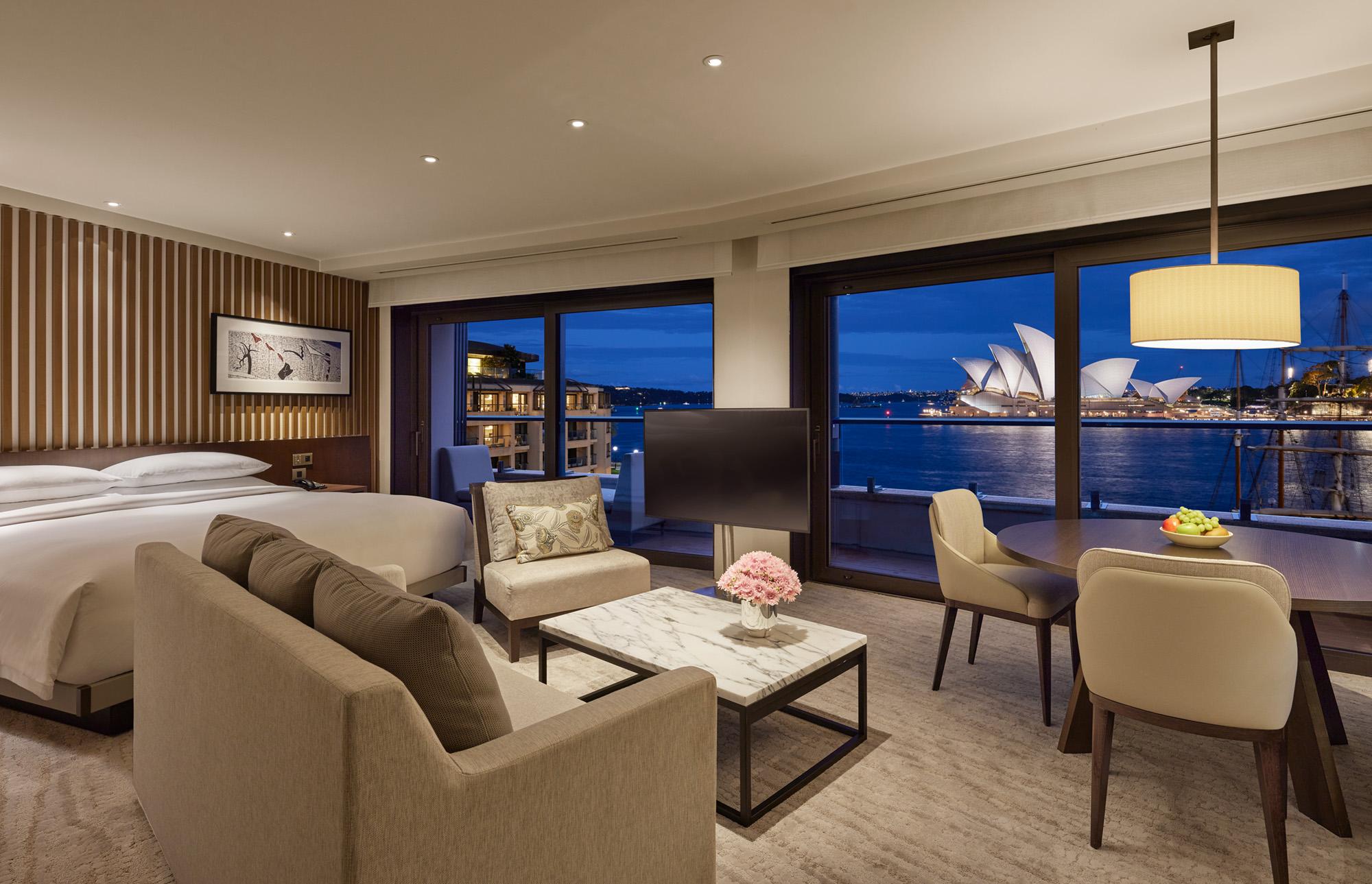 King Opera Deluxe room with custom leather furnishings and floor-to-ceiling harbour glass