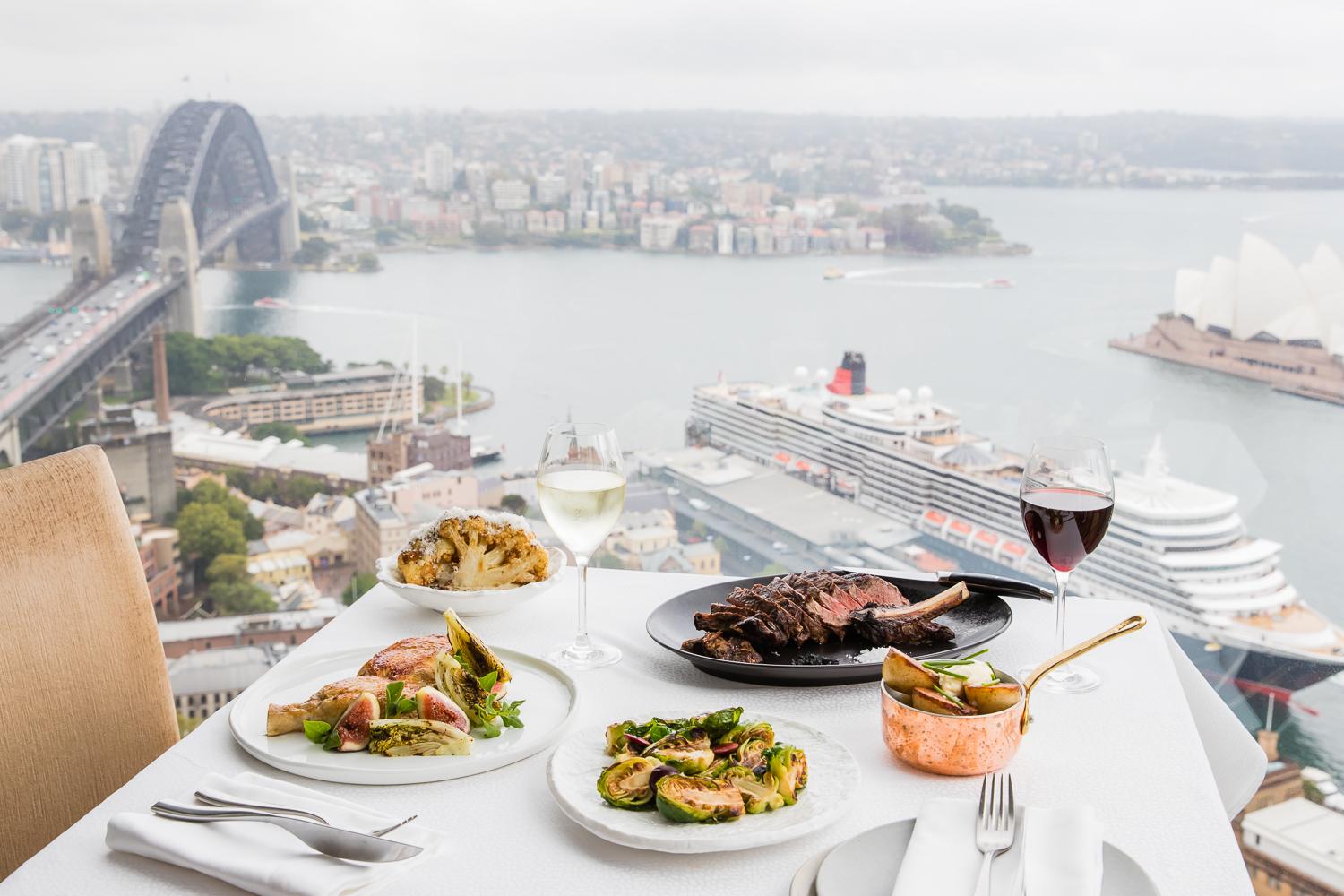 Altitude Restaurant soaring 36 stories above Sydney Harbour framing illuminated night panoramas