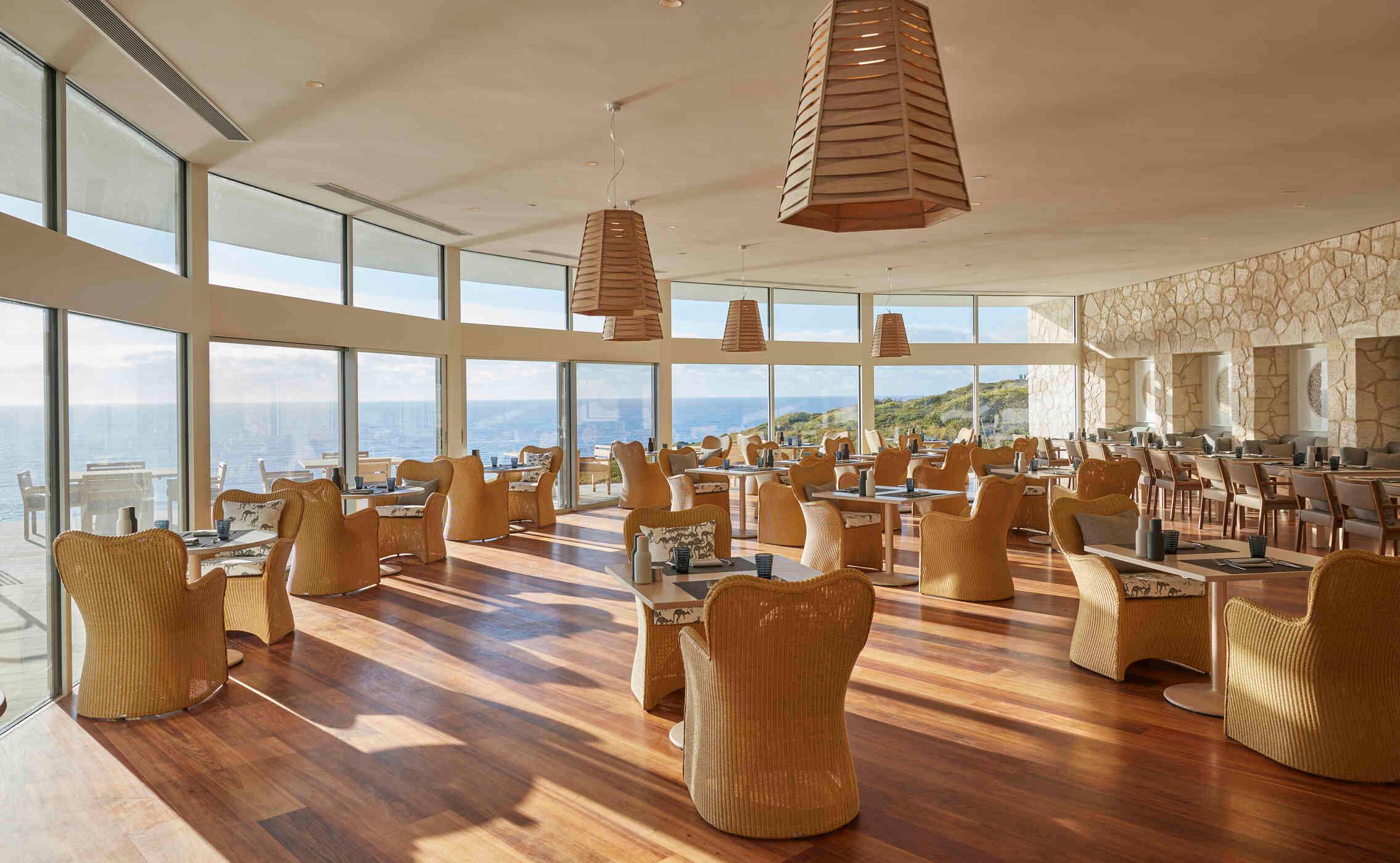 The Lodge Restaurant dining room with floor-to-ceiling ocean views