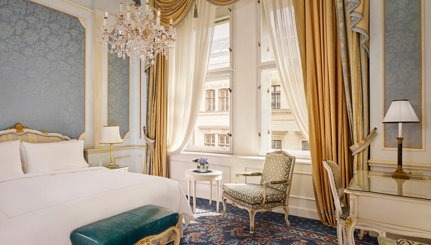 Classic Room featuring silk wall coverings, antique furnishings, and marble bath