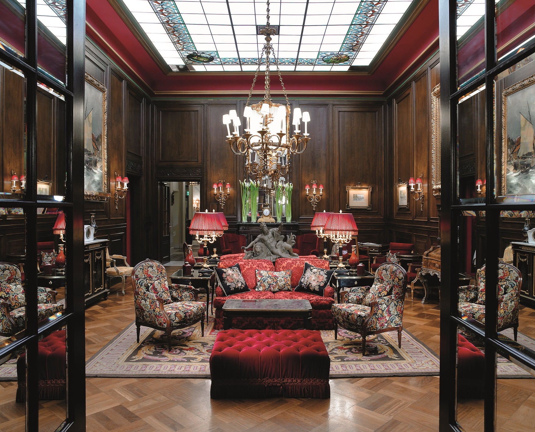Hotel Sacher Wien grand hotel lobby with antique oil paintings and crystal chandeliers