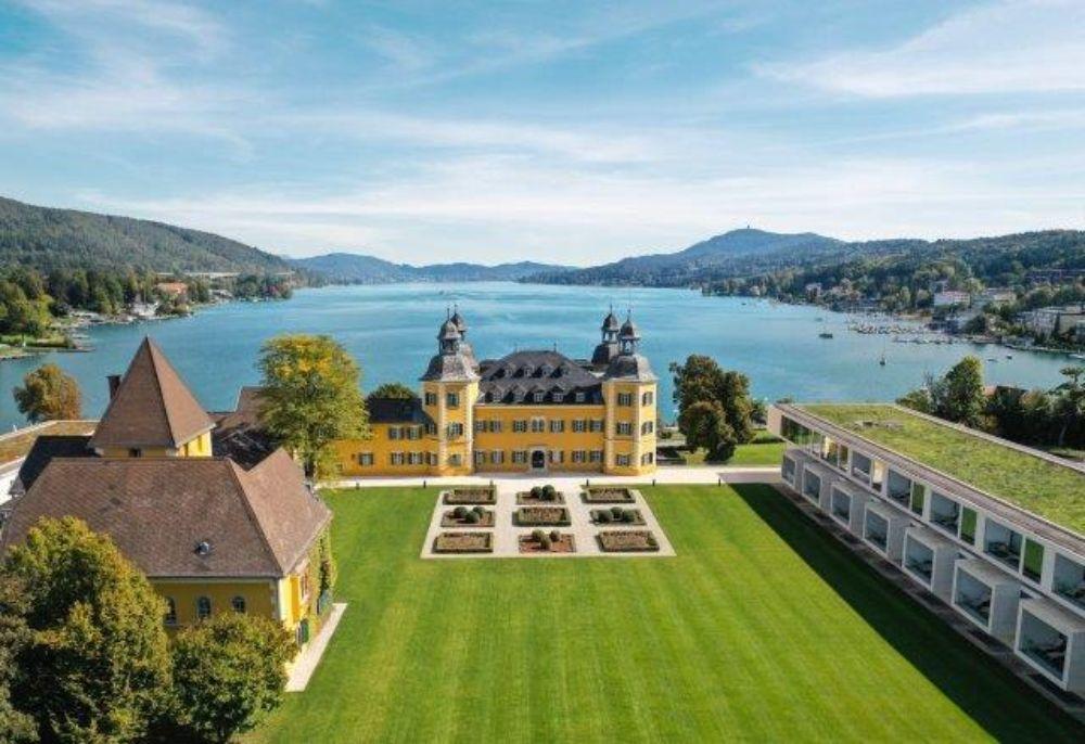 Falkensteiner Schlosshotel Velden aerial view over Lake Wörthersee and castle grounds
