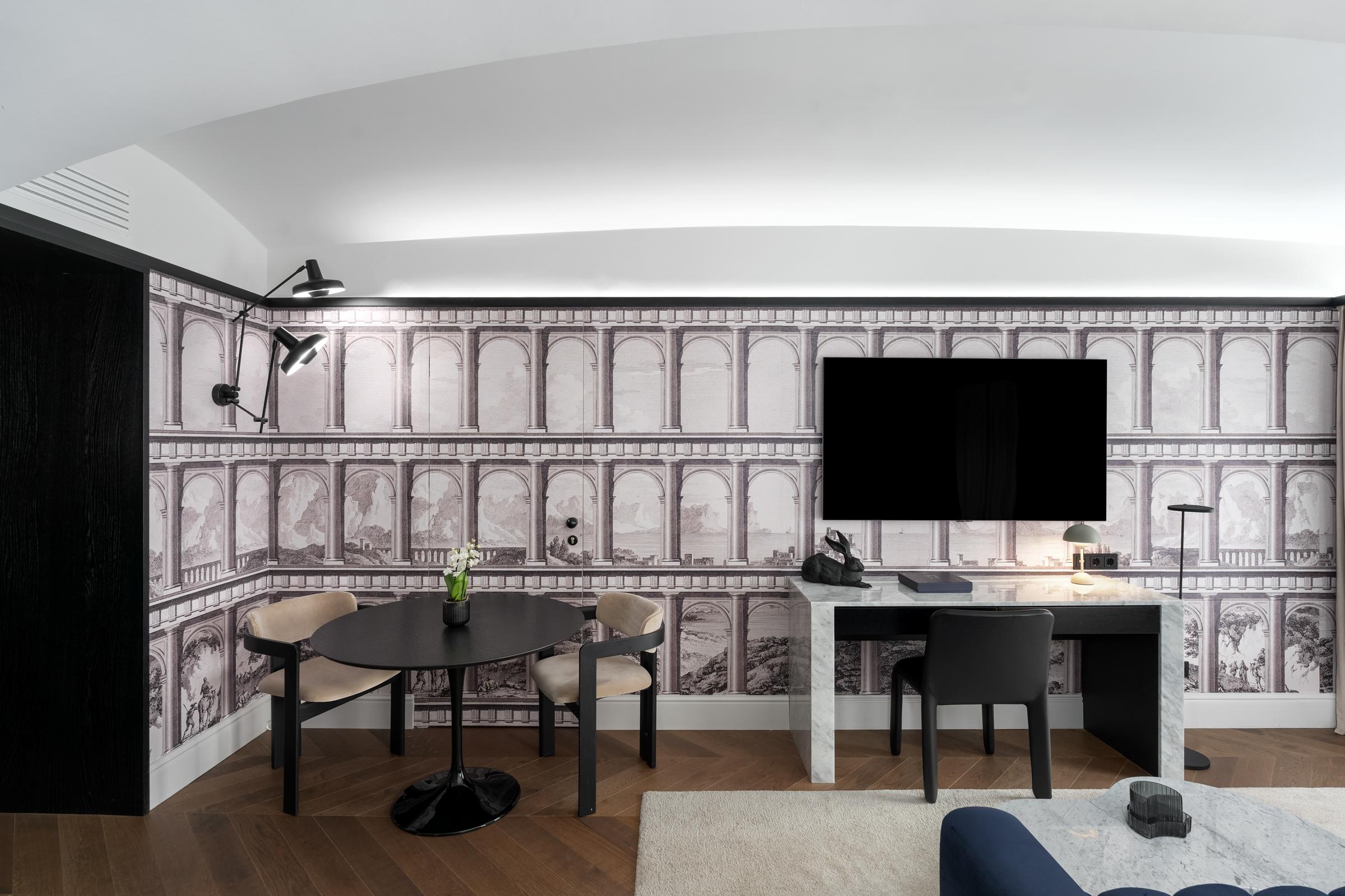 The Amauris Vienna Deluxe Room with high vaulted ceilings and Ringstrasse views
