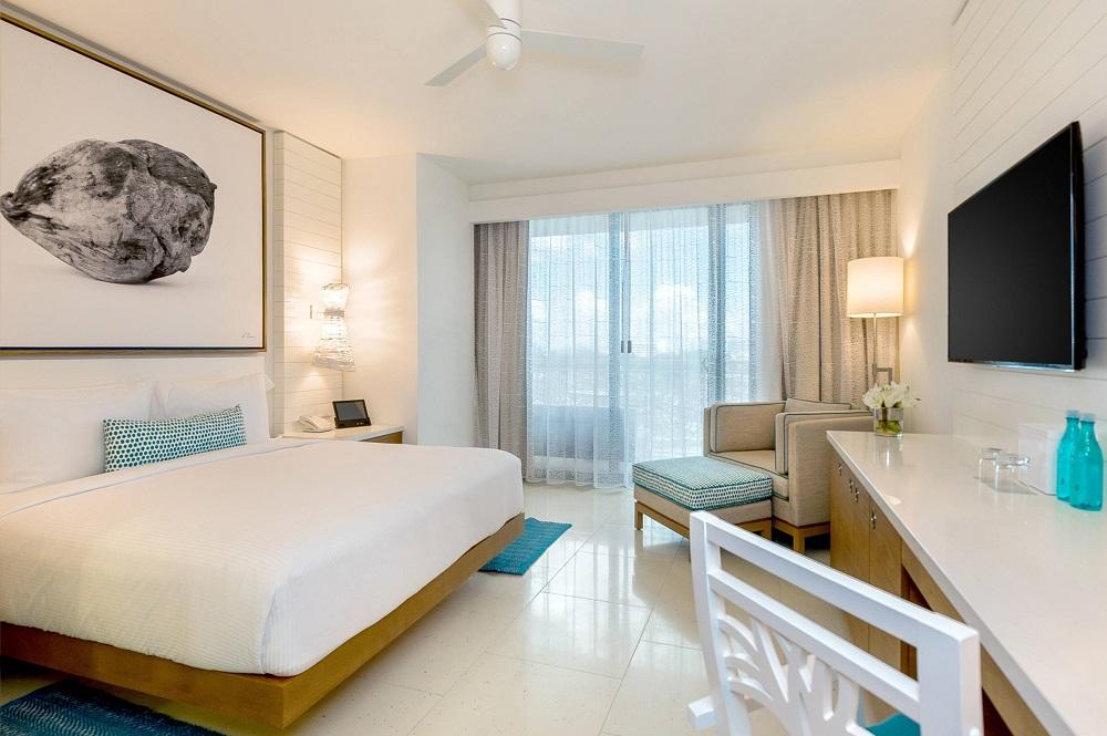 King Bed Ocean View guest room with private furnished step-out balcony