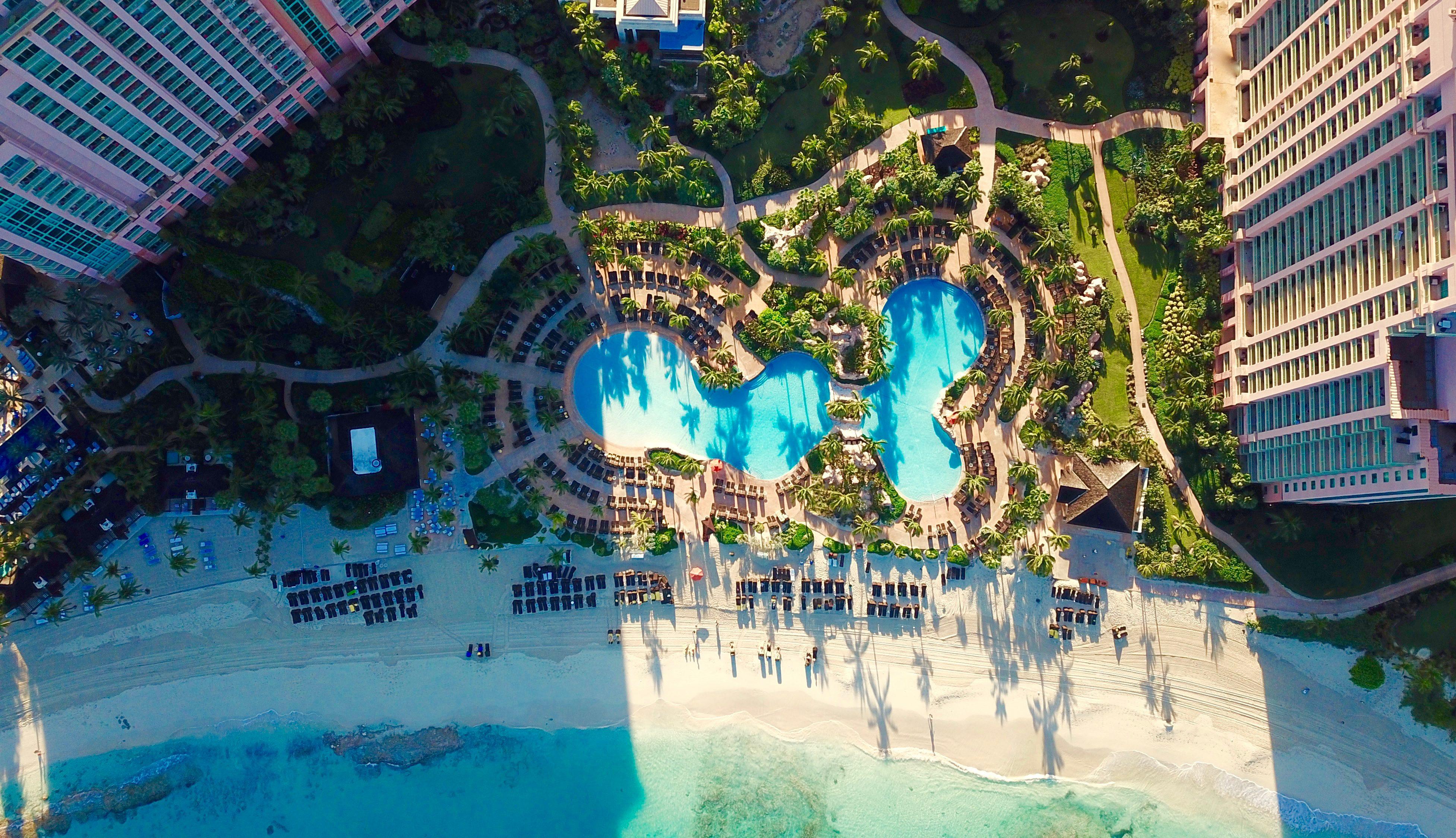 The Cascades Family Pool overhead view with sun decks and cabanas