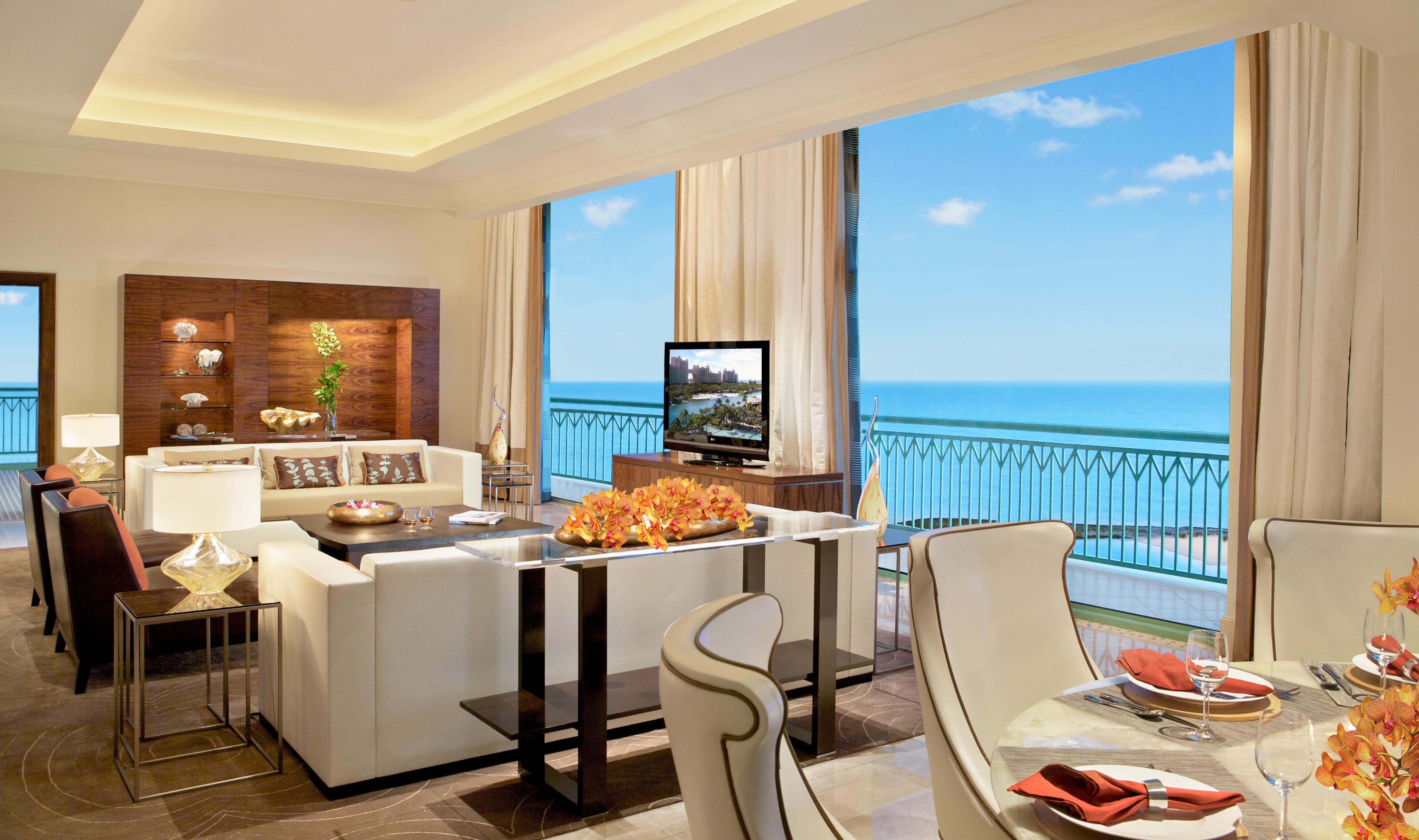 Penthouse Suite living and dining room with panoramic oceanfront windows