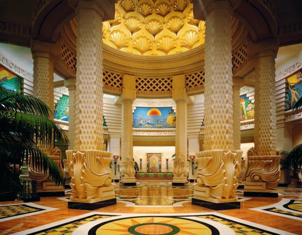 The Royal Grand Lobby with high vaulted ceilings and aquatic murals