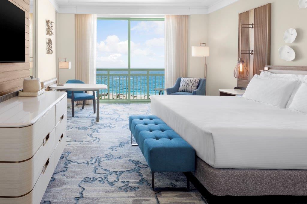 Newly renovated King Water View guest room with cool blue and ivory decor