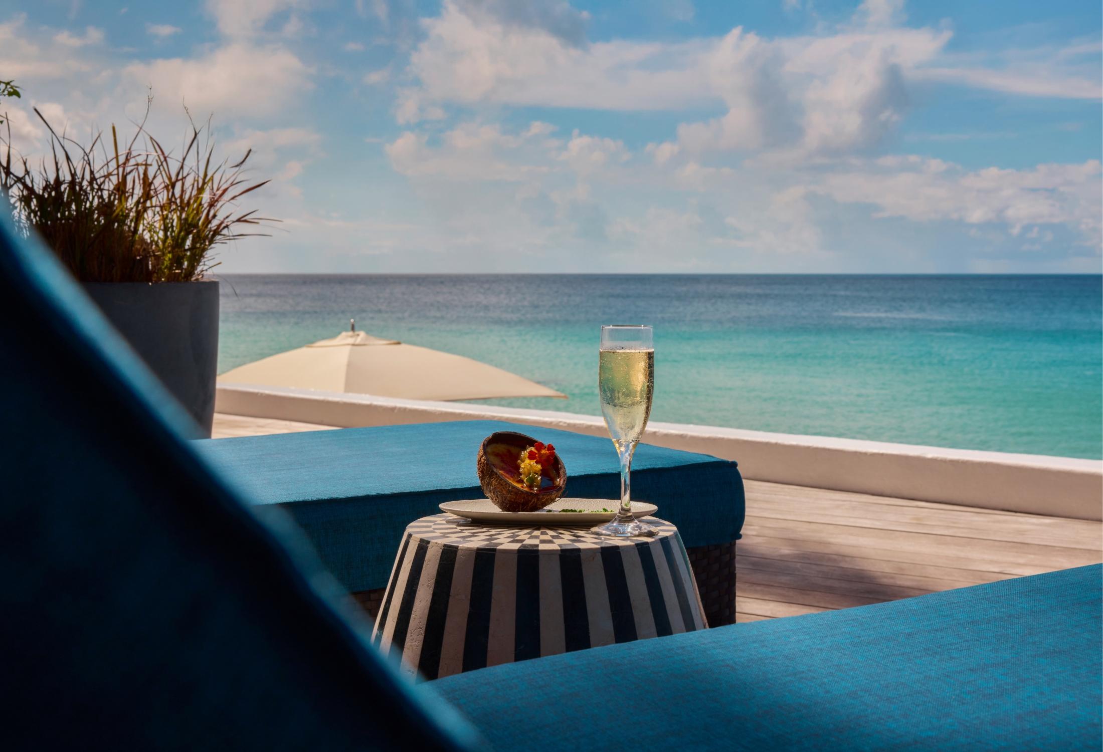 Beachfront Junior Suite private sun deck opening to the sand