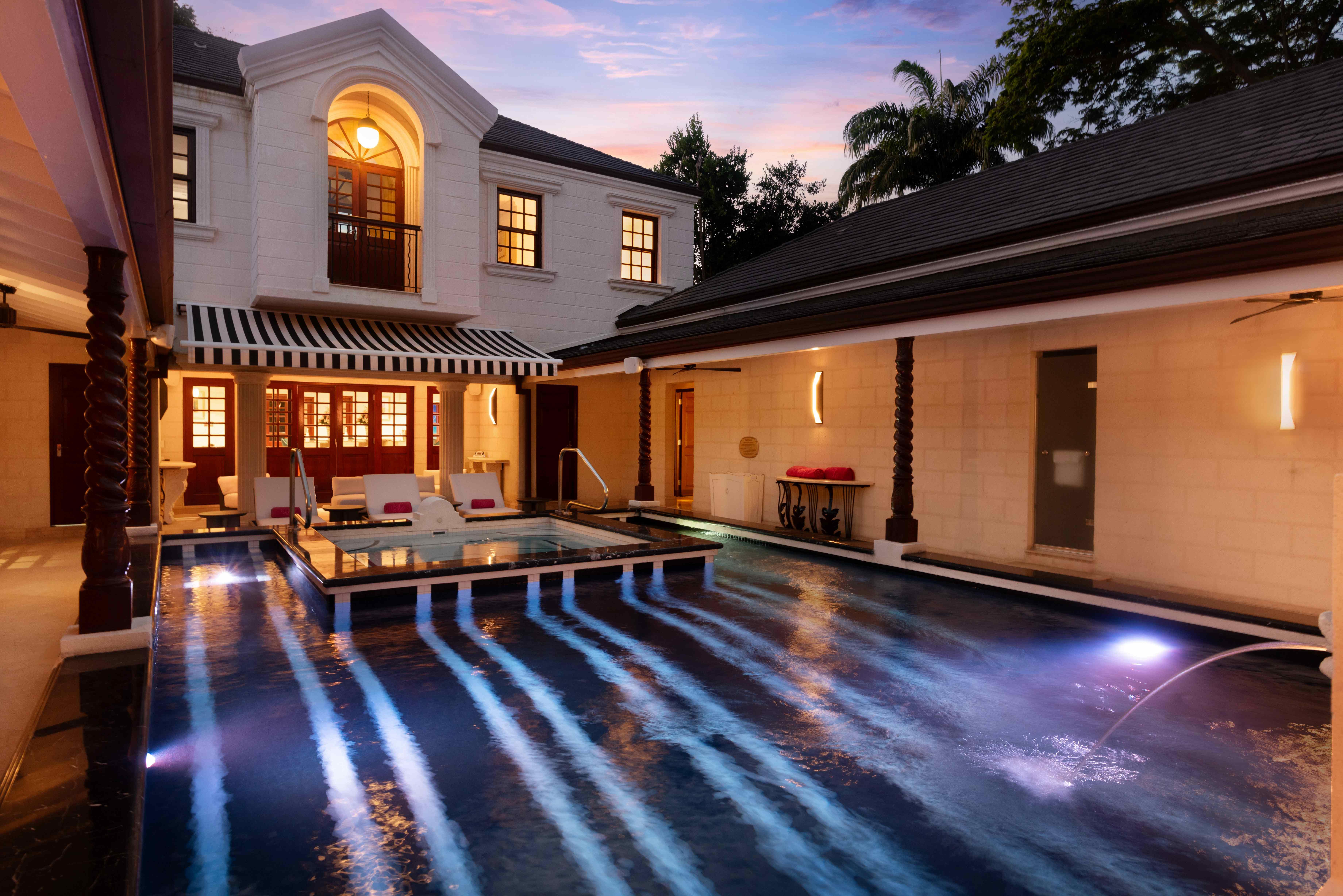 The Villa at Sandy Lane private pool and estate grounds at night