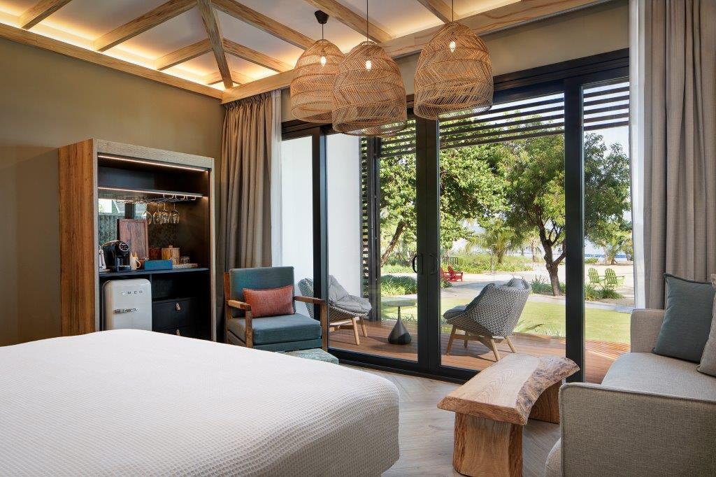 Luxury beachfront room with king bed at Peter Island Resort