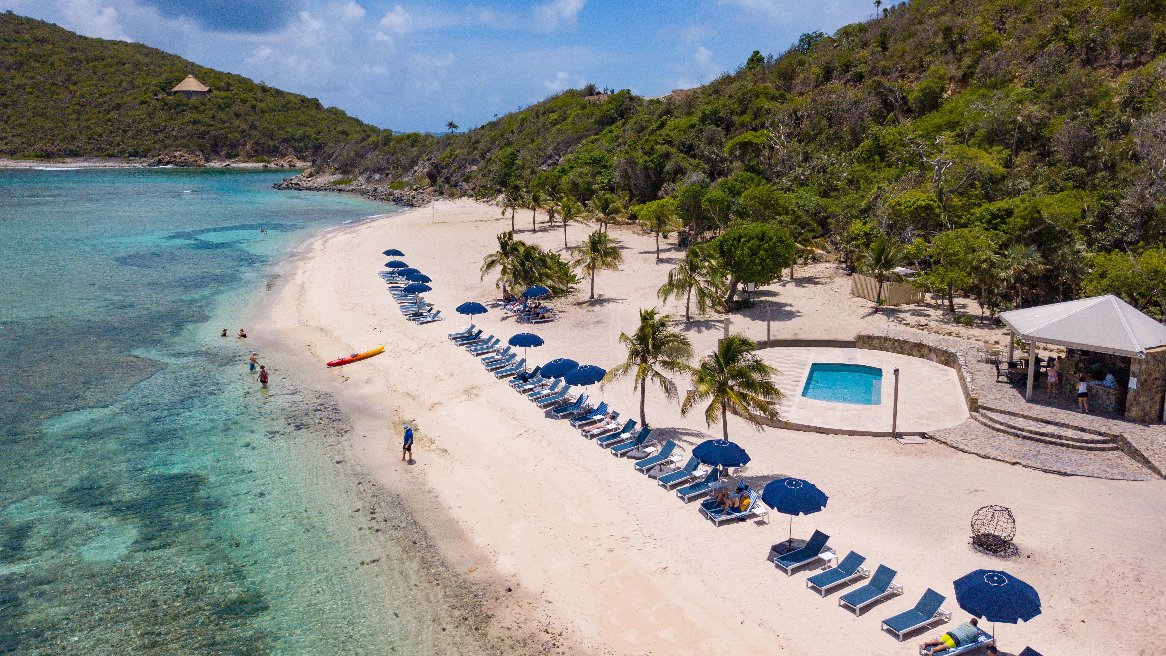 Pristine white sand beach and crystal-clear Caribbean waters at North Beach Scrub Island