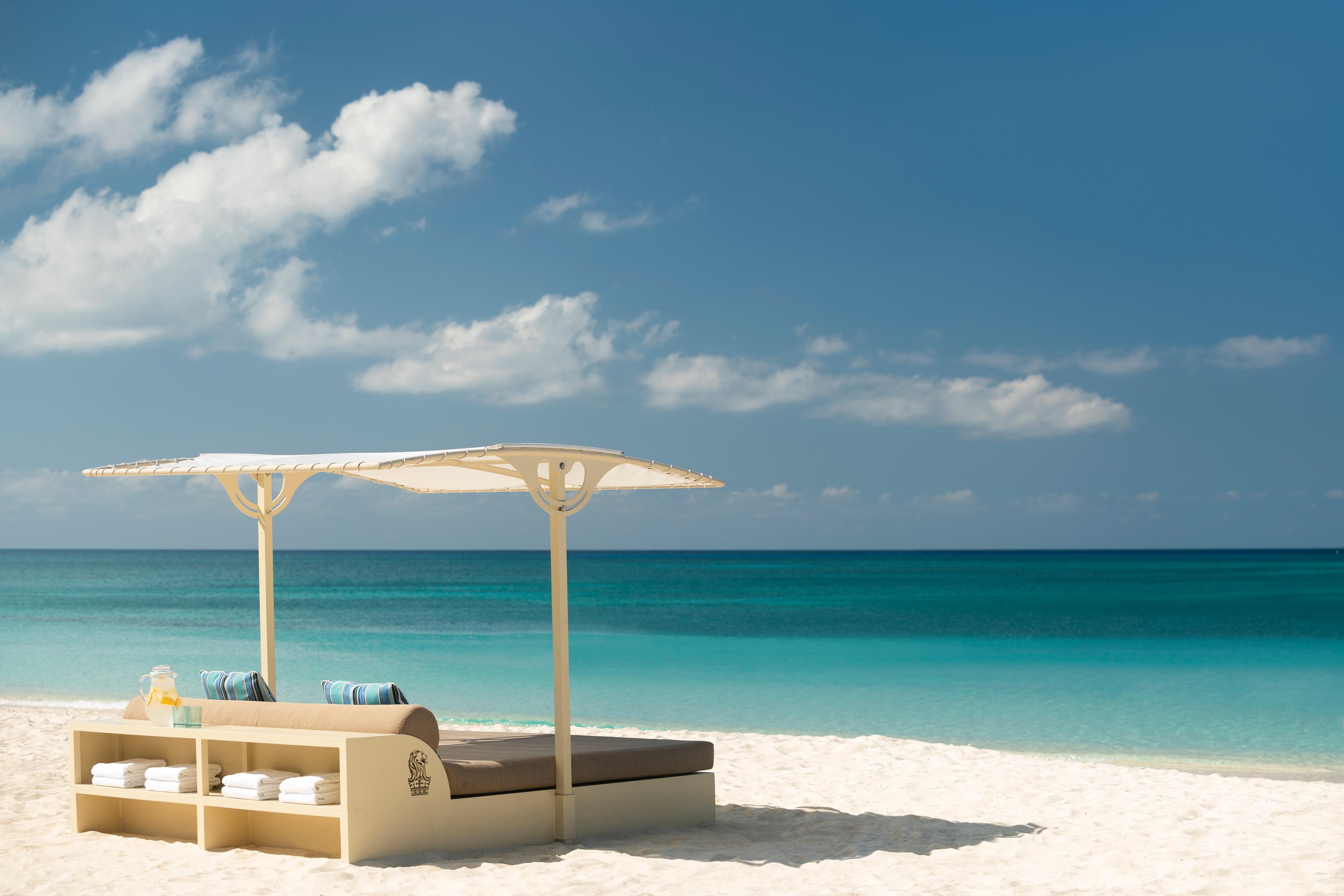 Reserved luxury beach daybeds on Seven Mile Beach