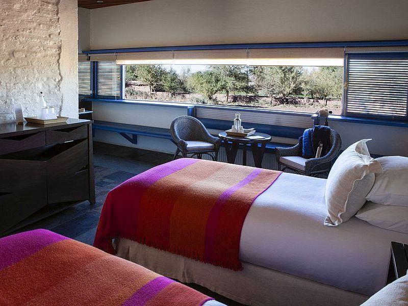 Explora Atacama Tulur Room with natural wood furnishings