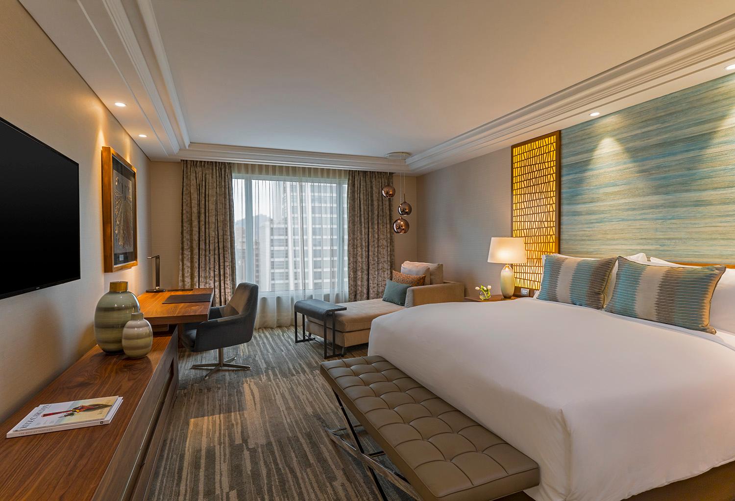 Deluxe Guest Room with Plush Bedding and City Views