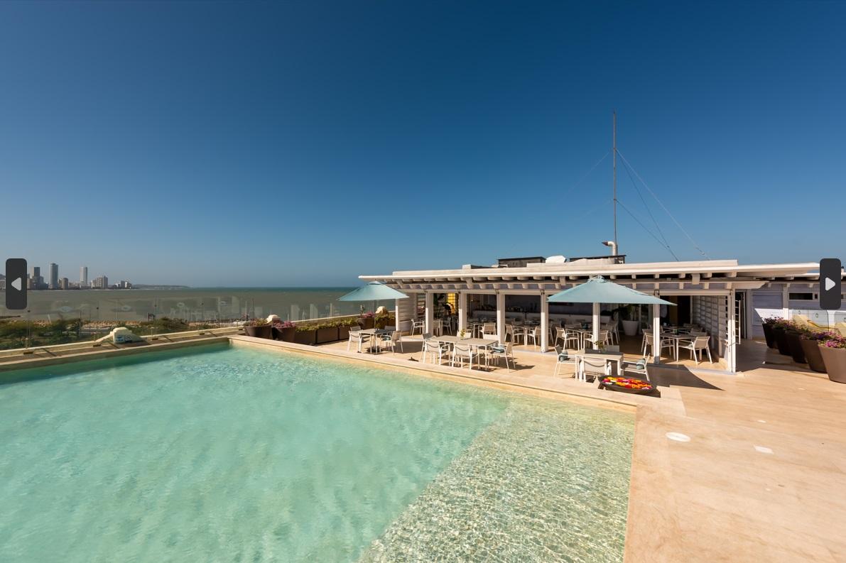 Rooftop swimming pool and solarium with Caribbean Sea view