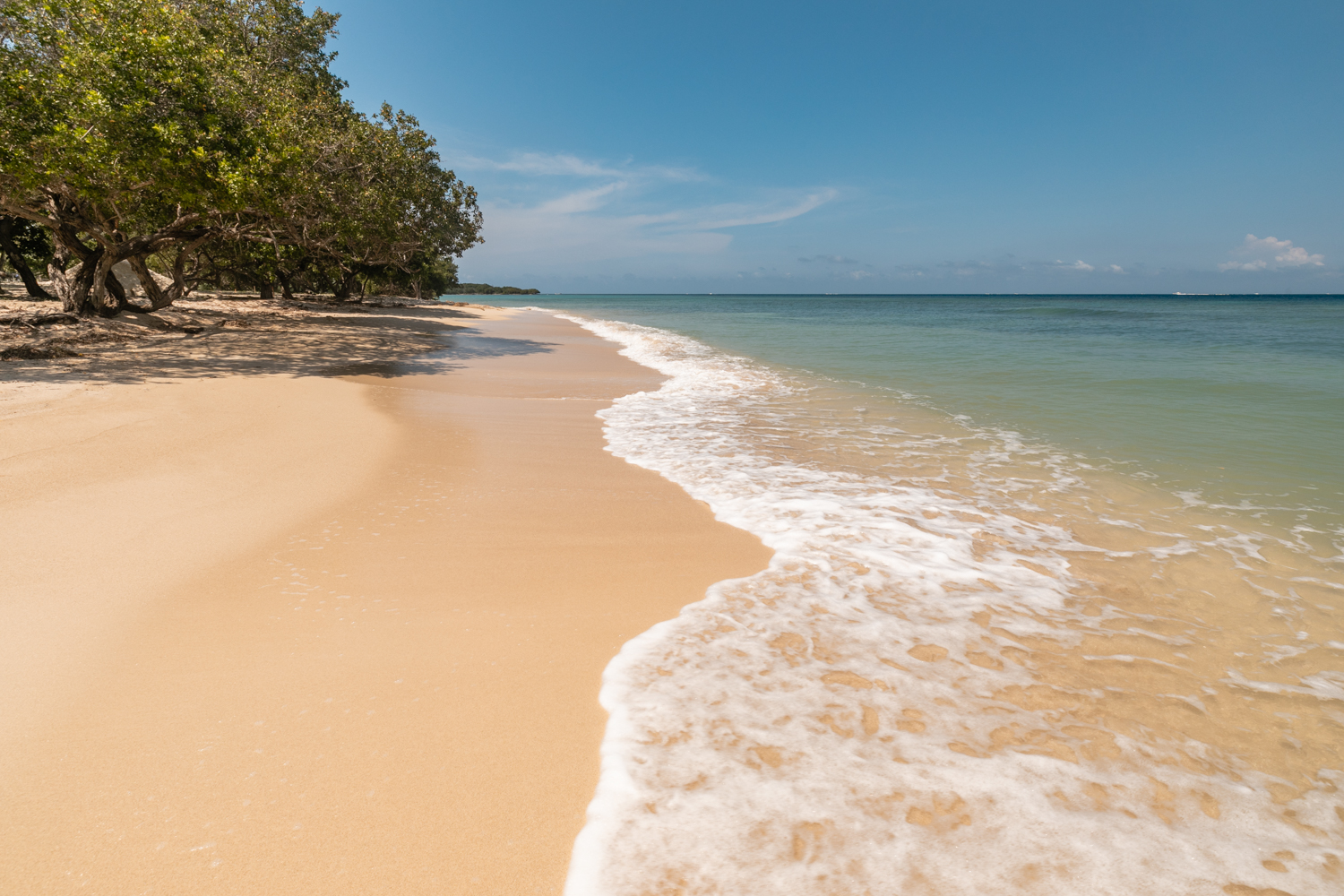 Powdery white sand beach and calm turquoise waters