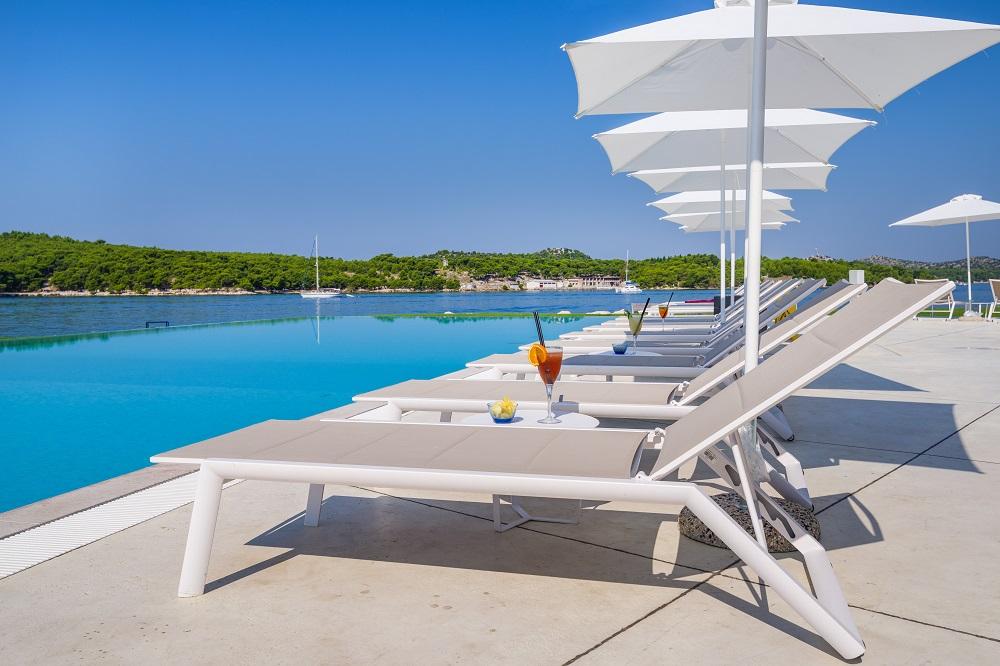 Seaside infinity swimming pool at D-Resort Sibenik overlooking Old Town
