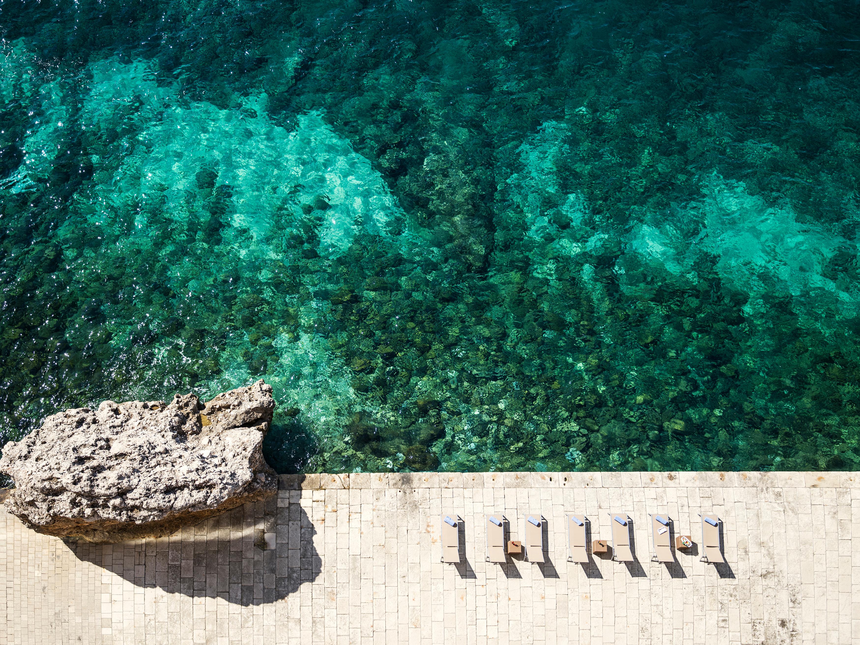 Private sea swimming platform on the rocky coast