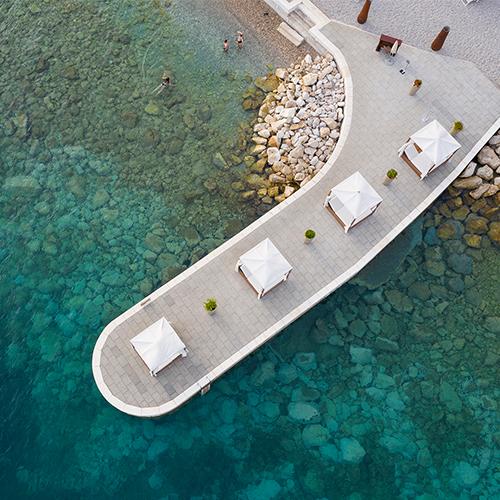 Natural pebble beach with crystal clear turquoise water