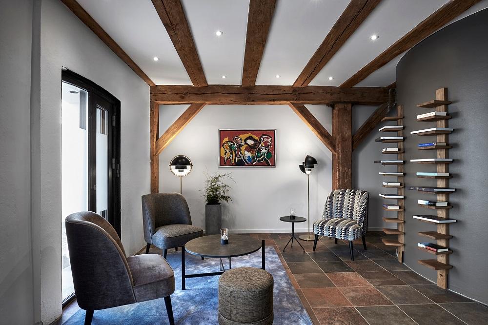 Cozy Heritage Warehouse Lounge with Classic Danish Furnishings