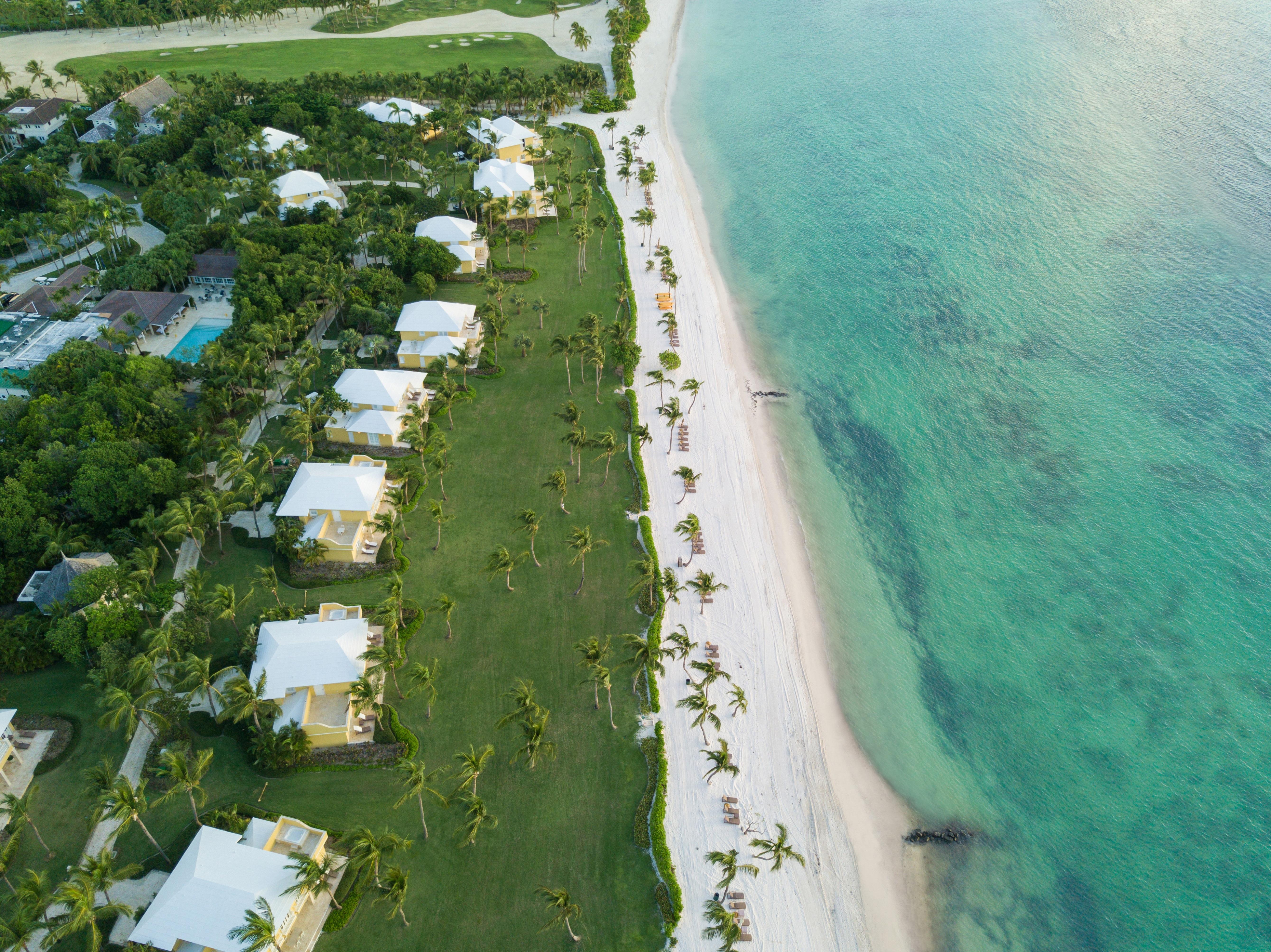 Tortuga Bay yellow villa architecture and private white sand beach